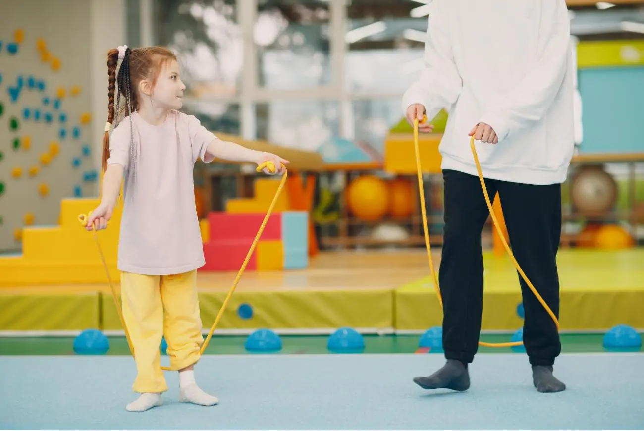 Young child with a skipping rope.