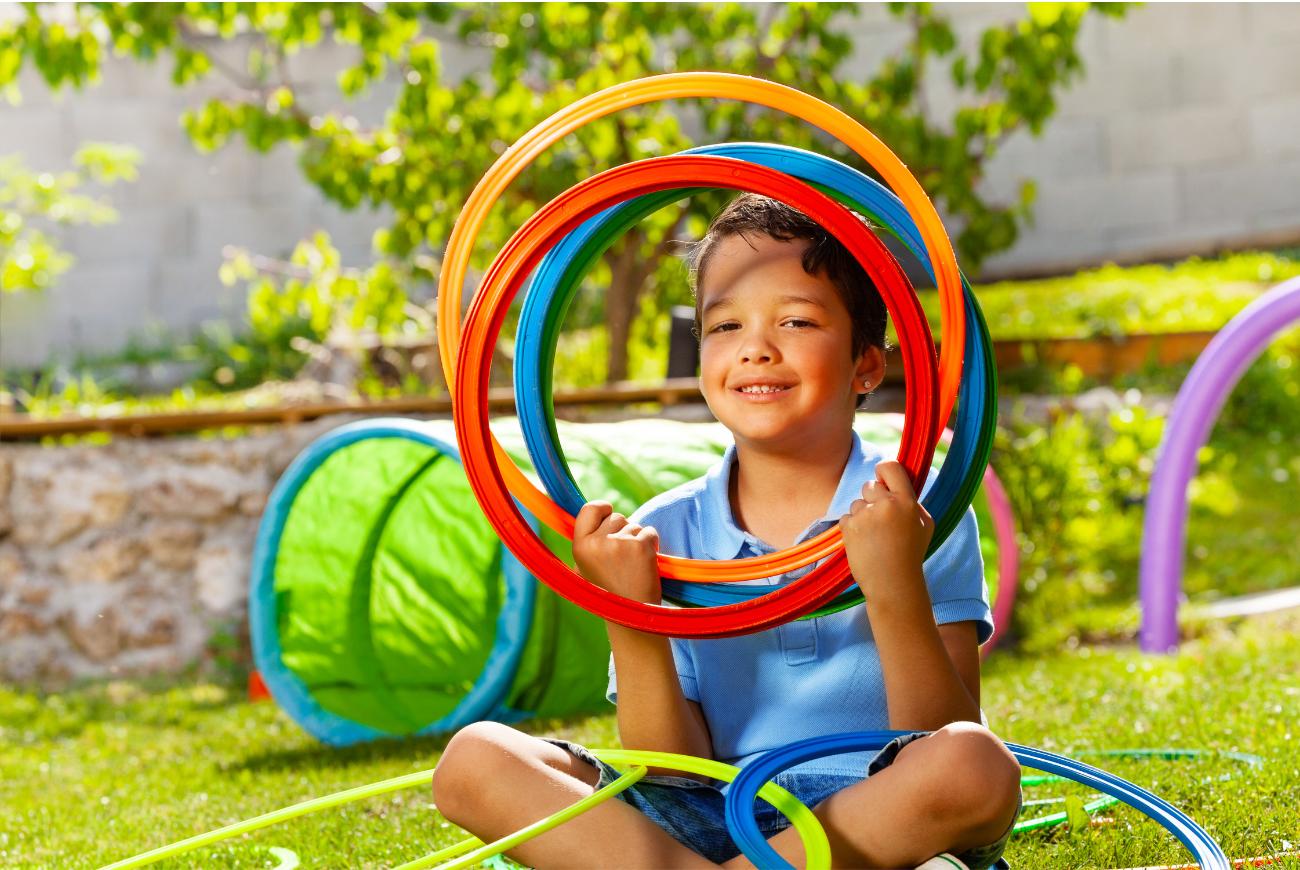 Kid with hula hoops.