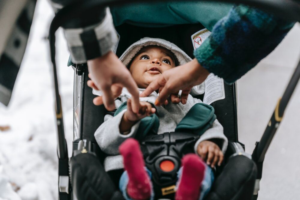 Baby in pushchair.