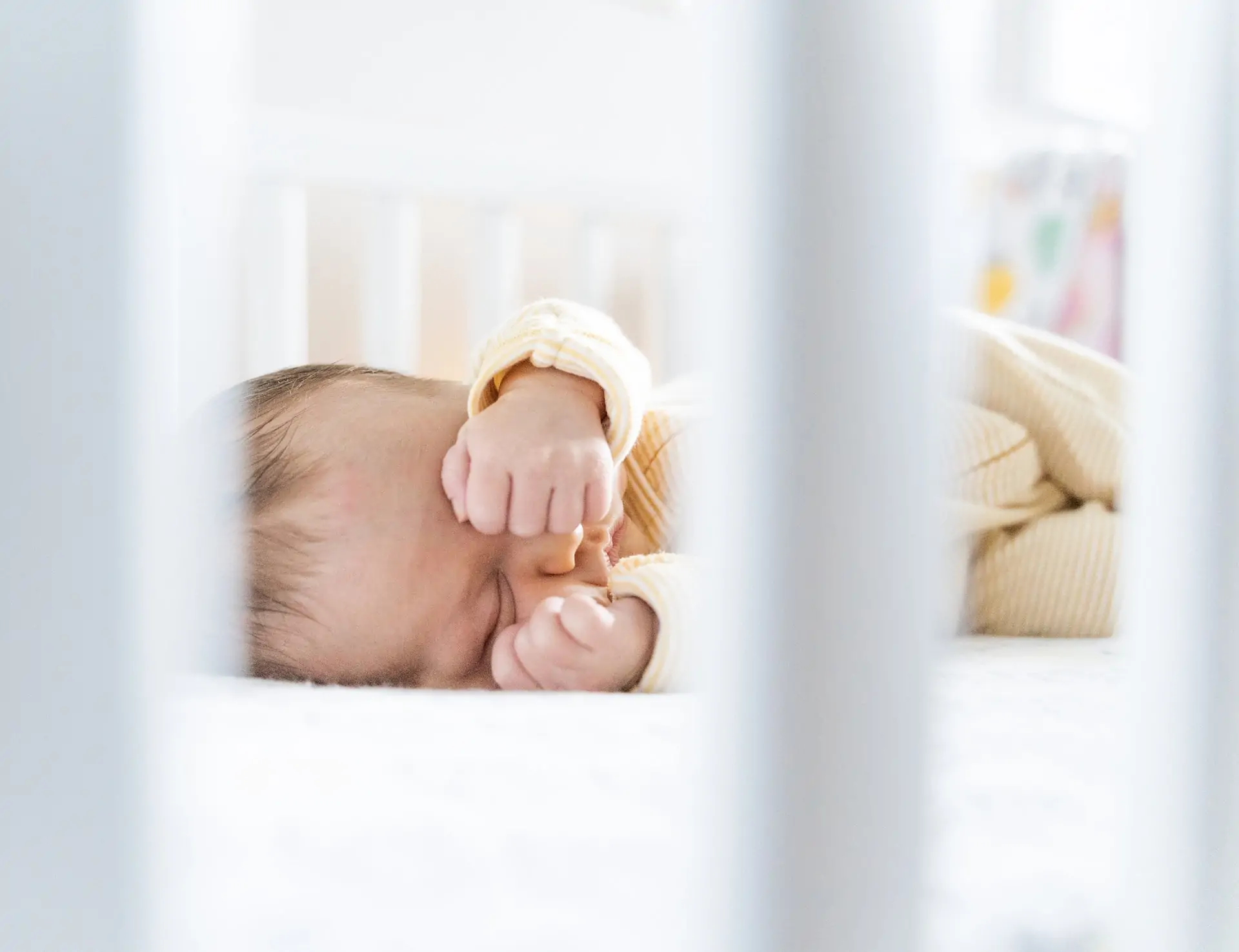 Baby sleeping in cot