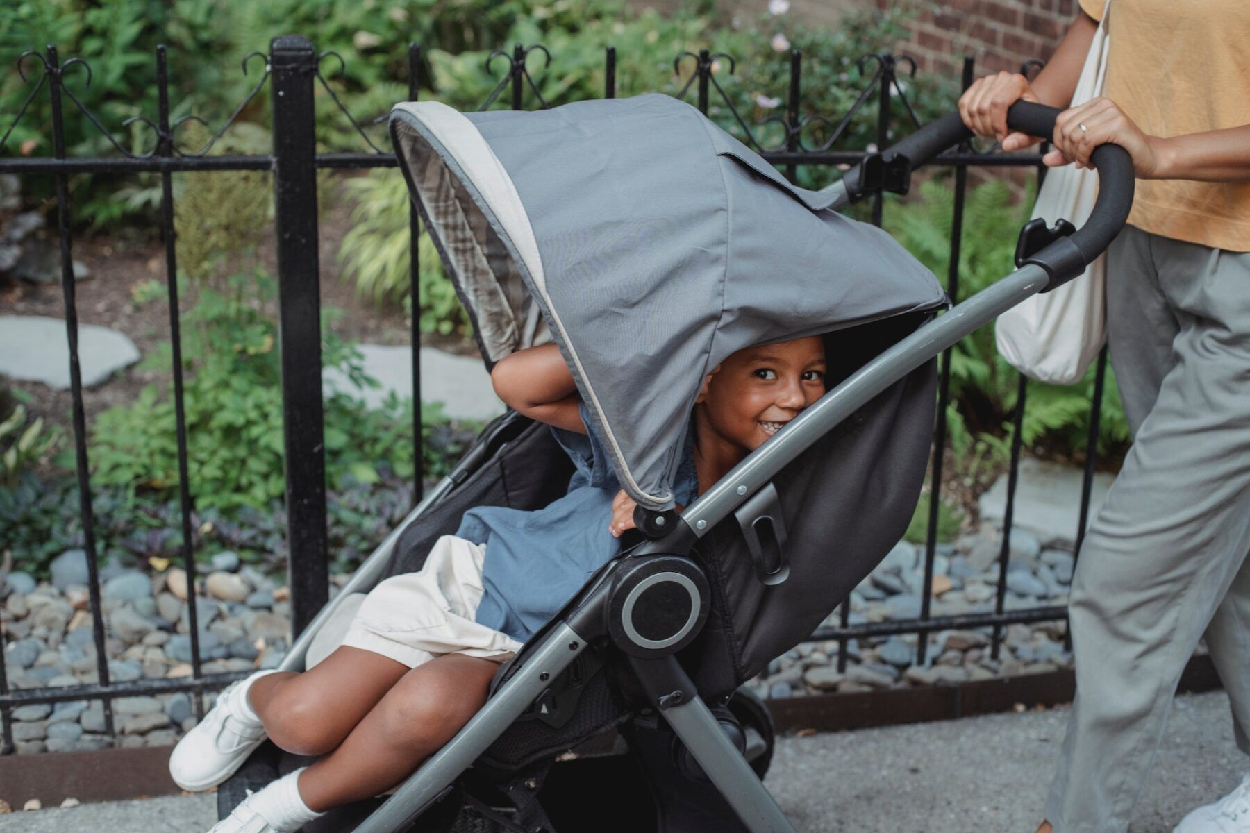 Child smiles in stroller