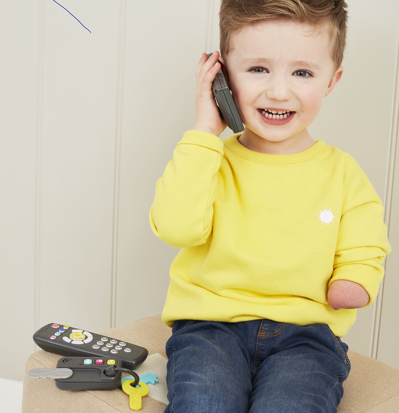 Boy plays with gadget toy set.