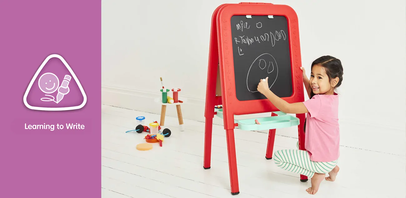 Girl writing on easel