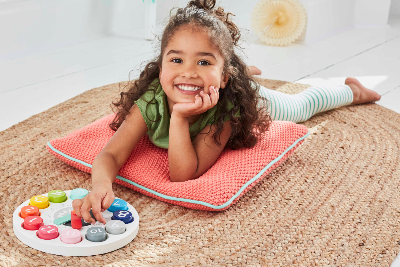 Girl playing with clock puzzle