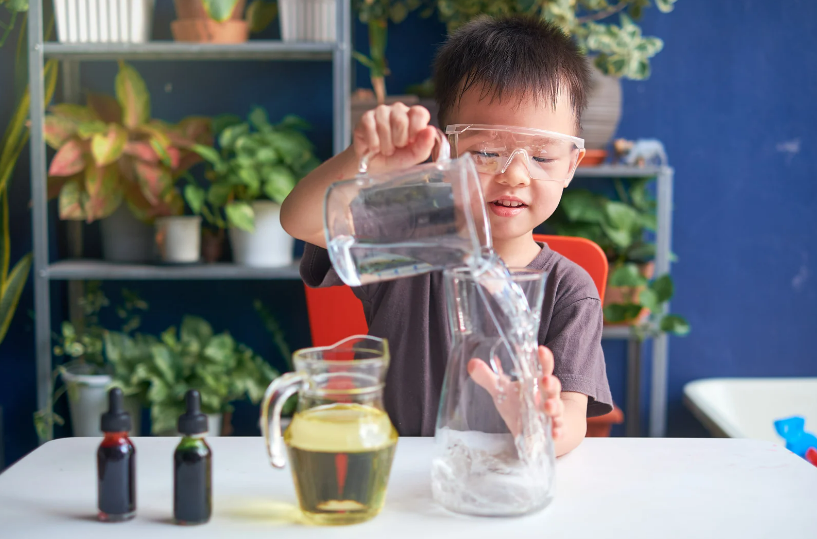 Toddler doing an experiment at home.