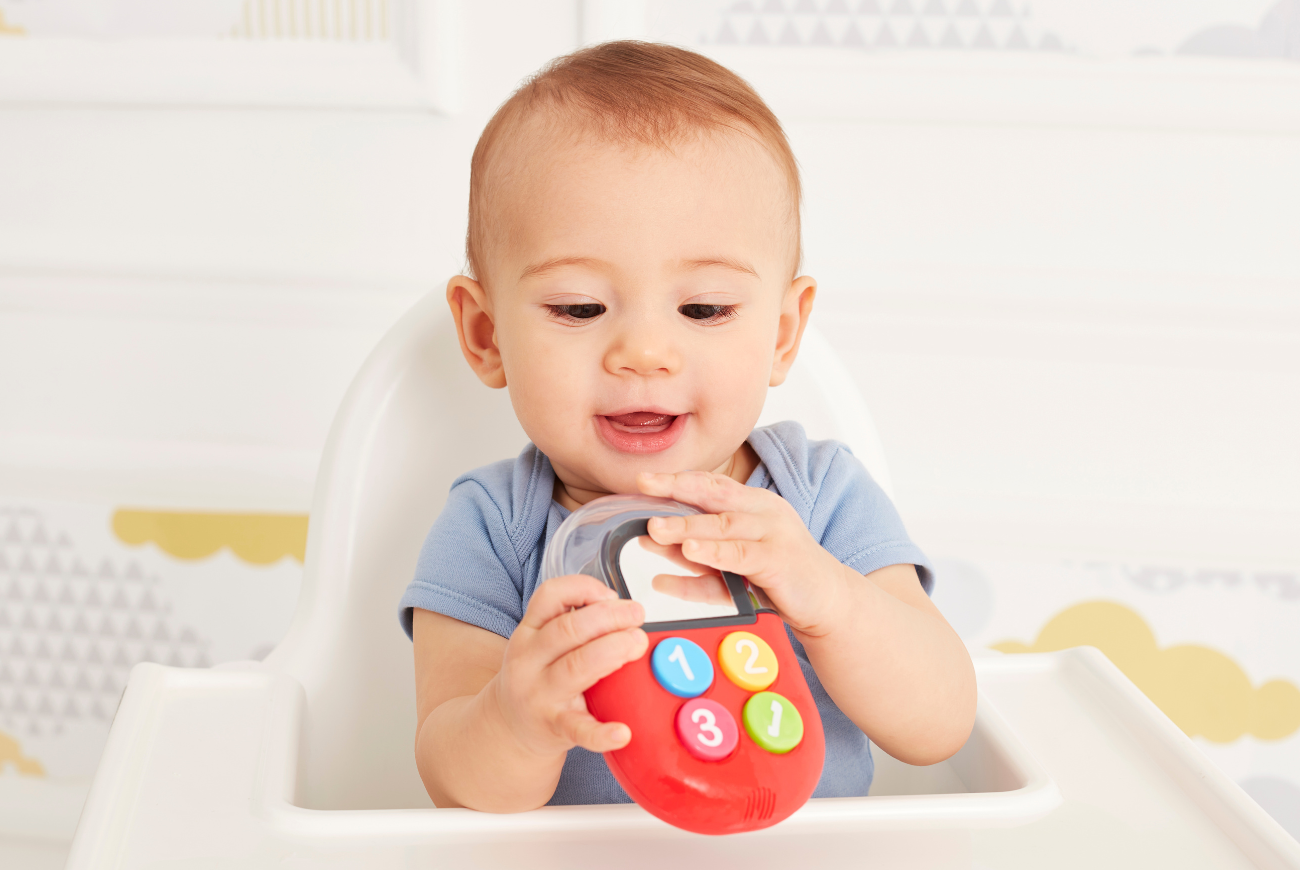 Young baby with an Early Learning Centre Gadget