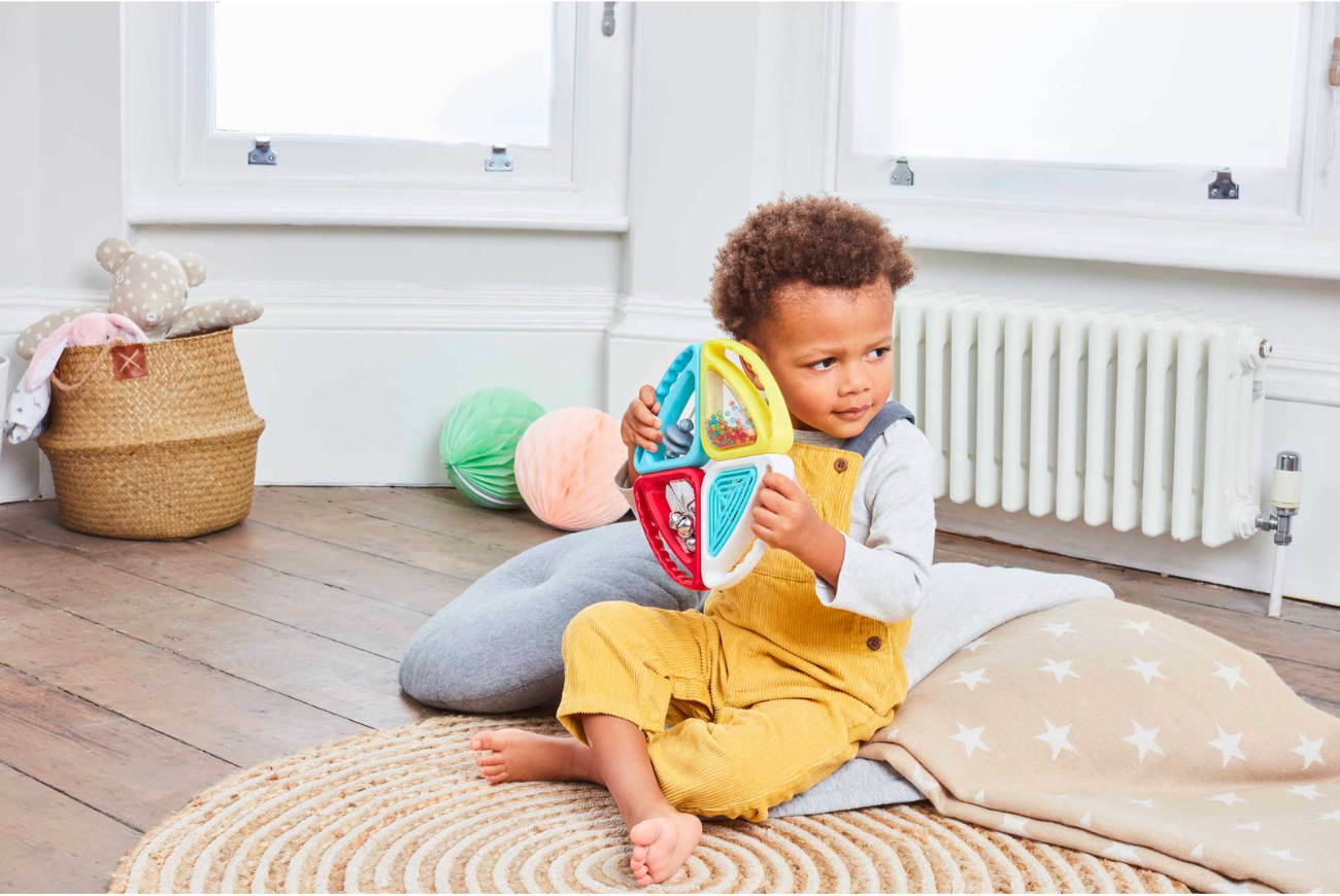 Young boy playing with a musical toy