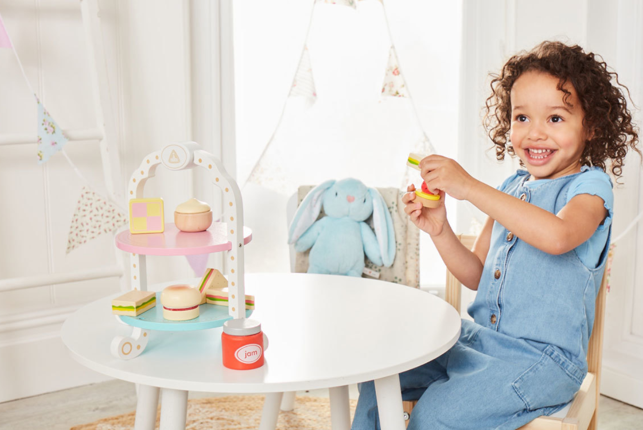 A young girl at a toy tea party